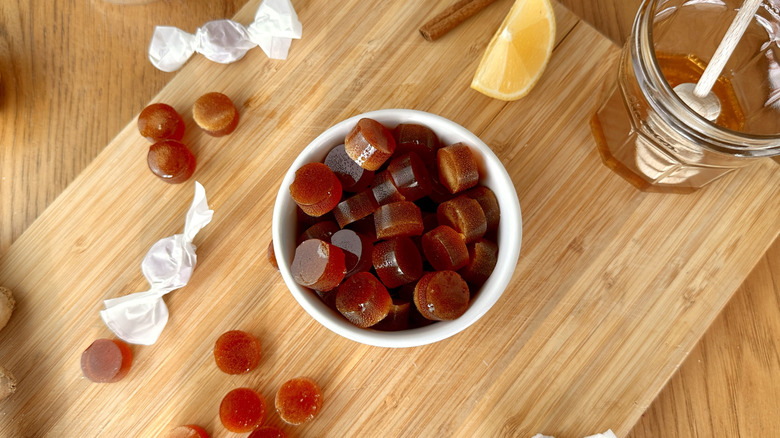 Ginger hard candies in bowl and on cutting board