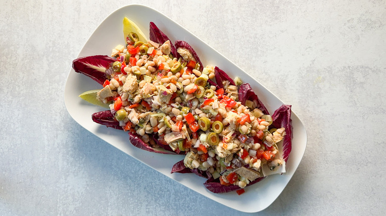 Spanish-inspired tuna salad atop Belgian endive on white platter