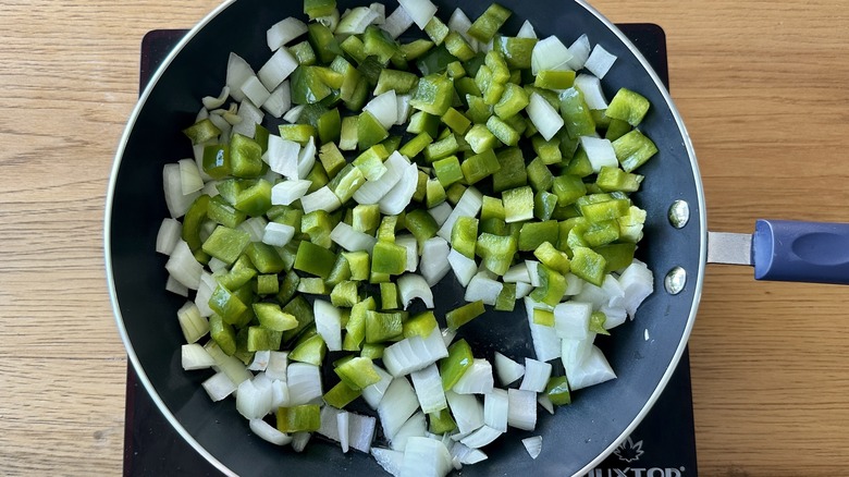 onion and green pepper in pan
