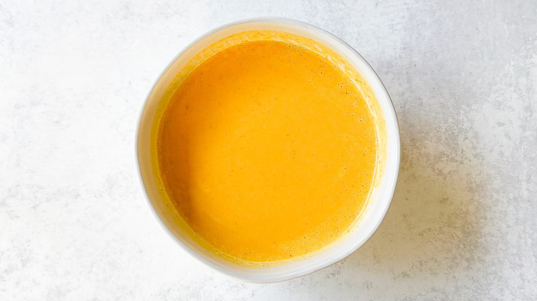 Spooky pumpkin curry Halloween soup in bowl