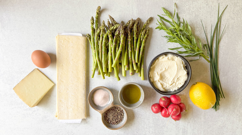 Springy asparagus and lemon ricotta tart ingredients on countertop