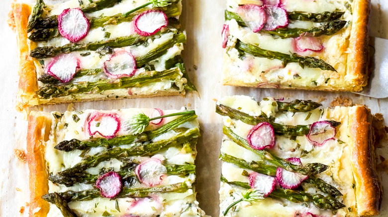 Springy asparagus and lemon ricotta tart slices close up
