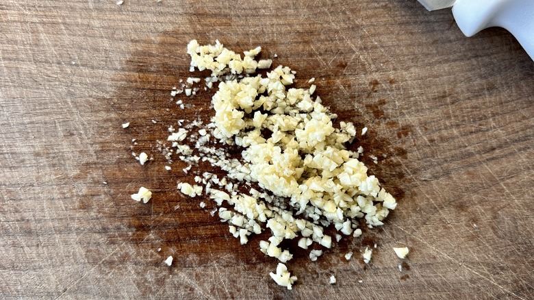 Minced garlic on cutting board