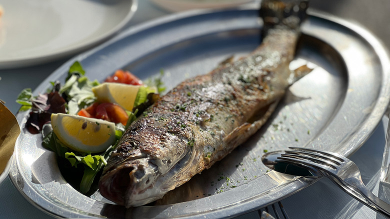a serving plate with Branzino in Italy