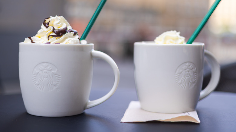 Starbucks mugs with a hot drink