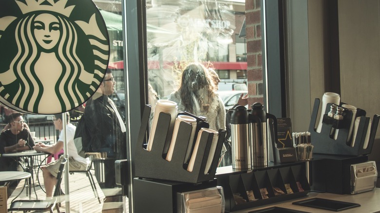 Condiment bar in front of Starbucks window