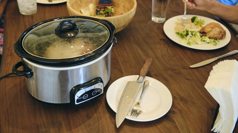 Crock-Pot on table with meal