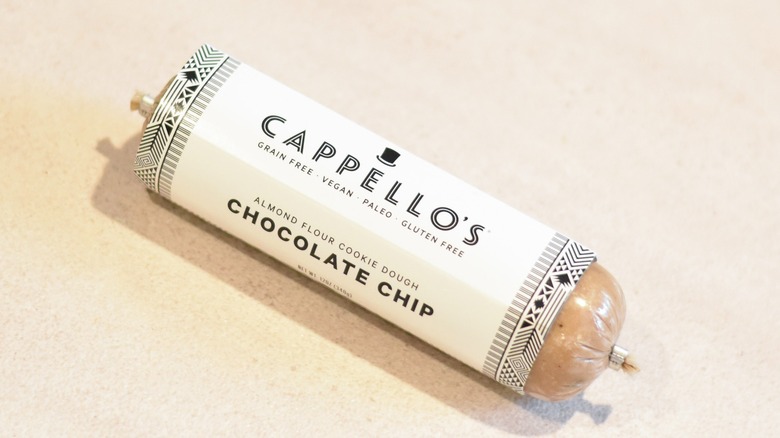 A tube of Cappello's chocolate chip cookie dough on a white counter