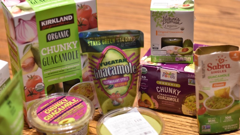 Guacamole containers on table