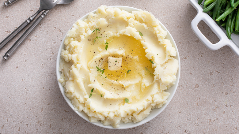 Mashed potatoes on beige background