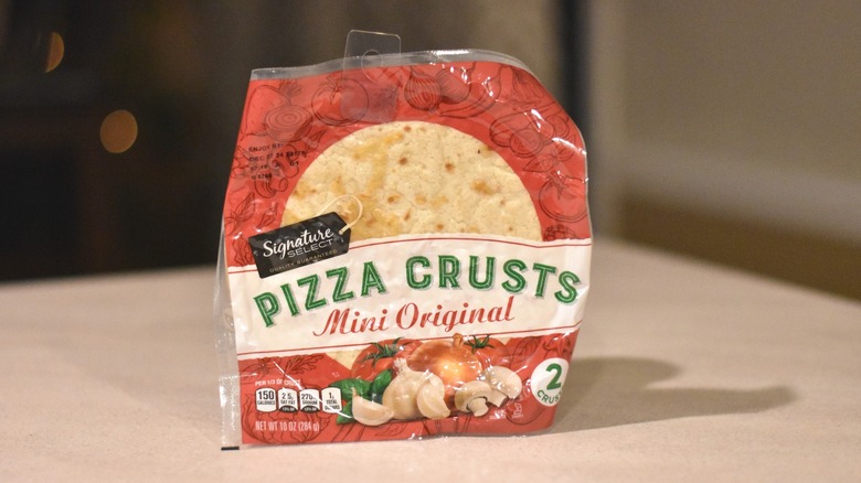 A package of Signature Select mini original pizza crusts