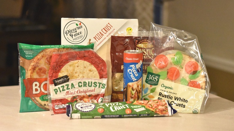 Pizza crusts in packaging on a counter