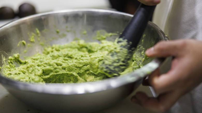 chef's bowl of avocado mashed