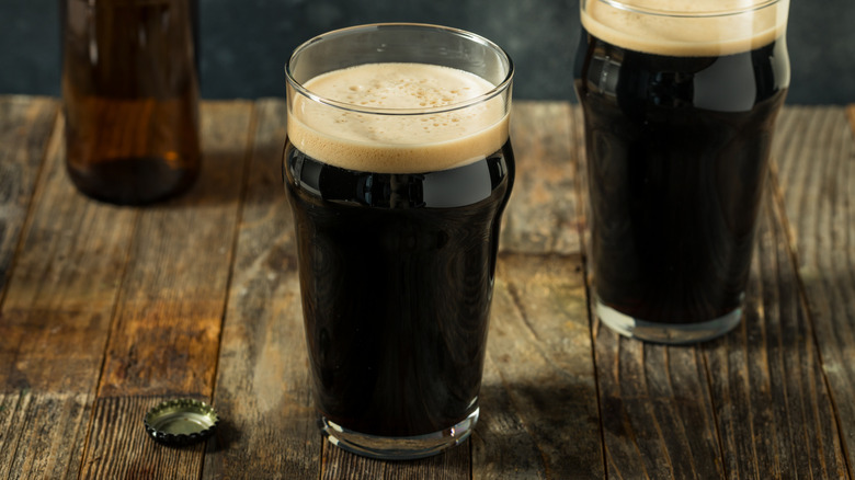 Stout beers on wooden table