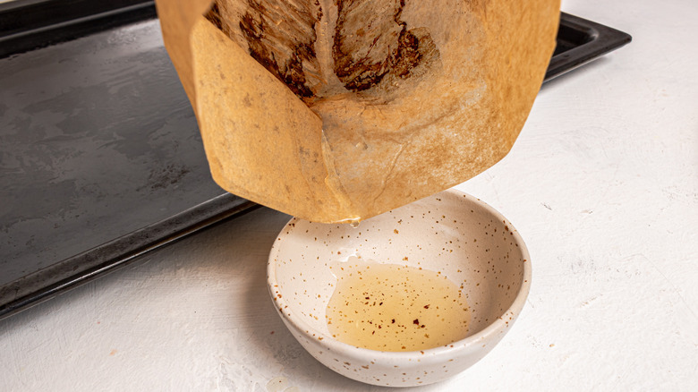 pouring bacon fat into bowl