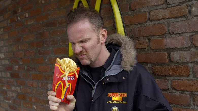 Morgan Spurlock smelling french fries 