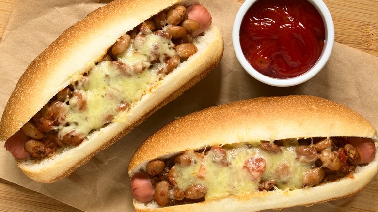 hot dogs topped with bean chili and cheese