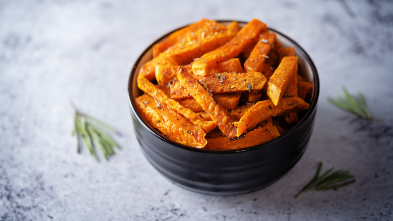 Butternut squash french fries in black bowl