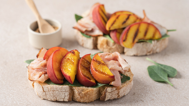 Grilled peaches on an open-faced sandwich