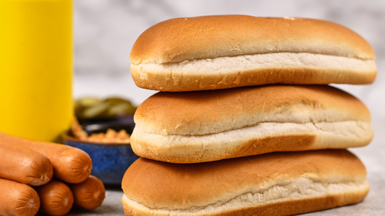 three hot dog buns stacked