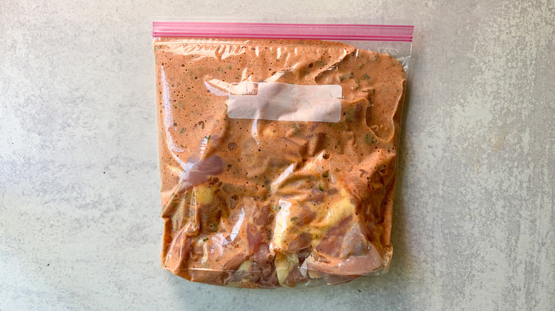 Chicken thighs and buttermilk brine in large ziplock bag