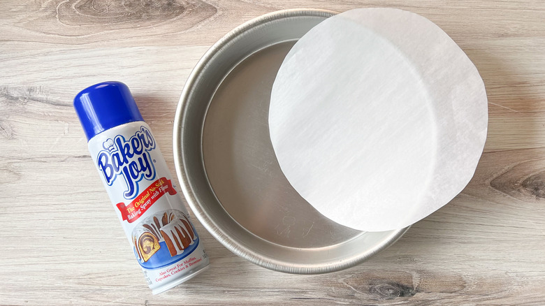 Round baking pan with round parchment paper and non-stick baking spray