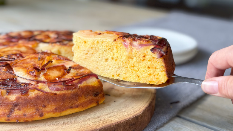 Slice of sweet and savory upside down cornbread on spatula