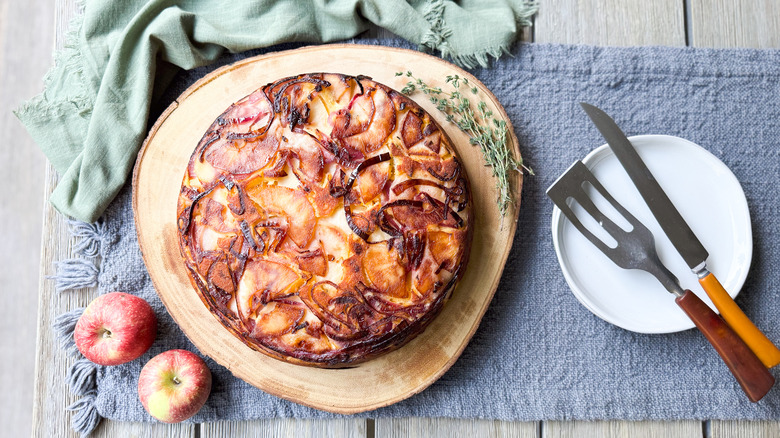 Sweet and savory upside down cornbread on cutting board on table with serving pieces