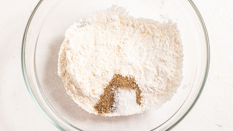 Bowl with flour, cornstarch black pepper, and salt