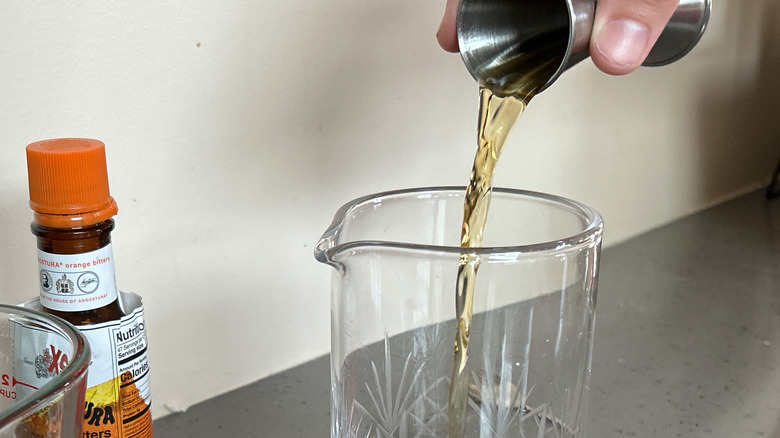 whiskey pouring into glass