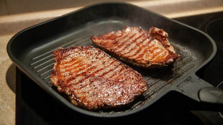 Cube steaks in frying pan