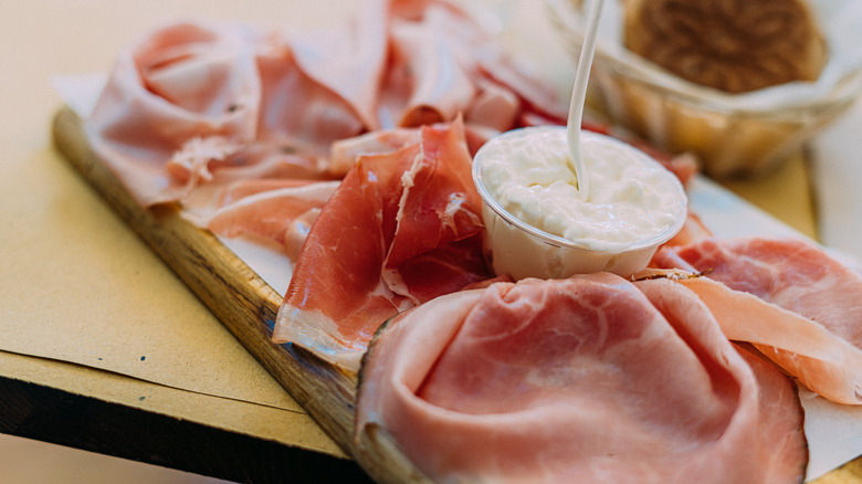 close-up of meats arranged on charcuterie board