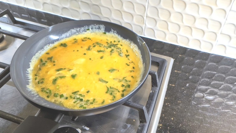 Omelette cooking on stove