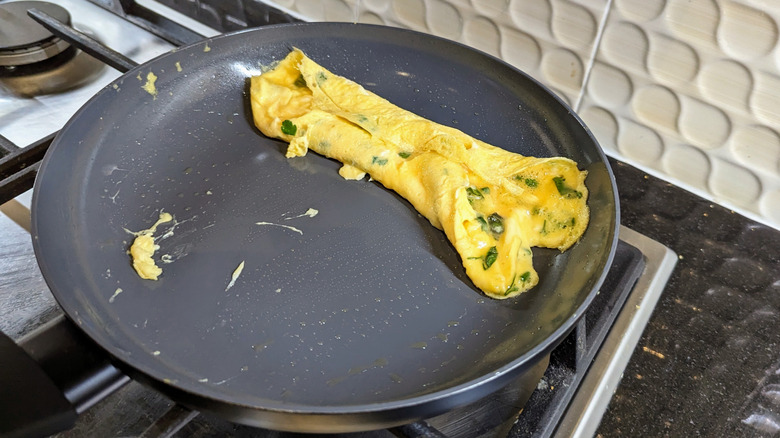 Folded French omelette in pan