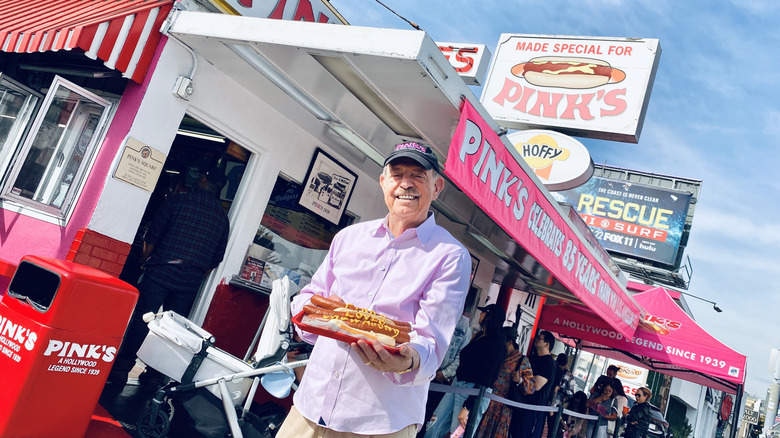 Richard Pink stands outside Pink's Hot Dogs in Los Angeles