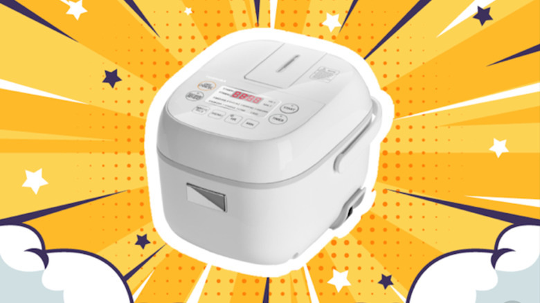 A Toshiba Rice Cooker on a yellow colorful background