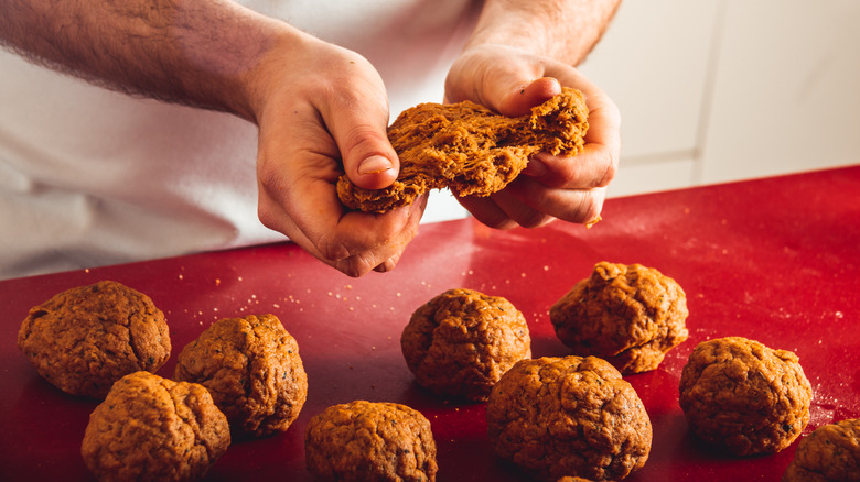 person kneading seitan balls