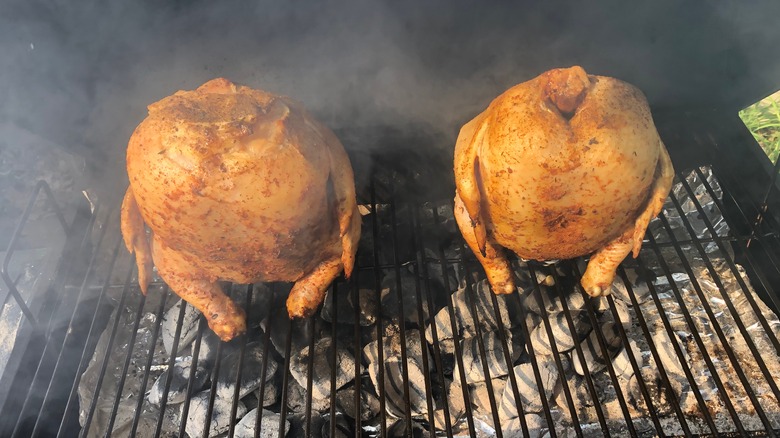 Two chickens on a grill