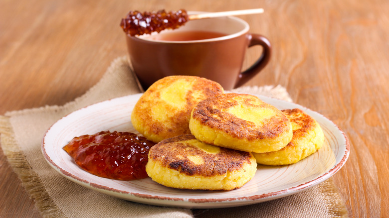 Plated cornmeal fritters with jam