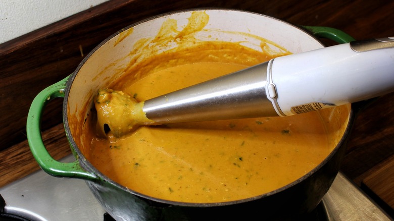 immersion blender in pot of soup