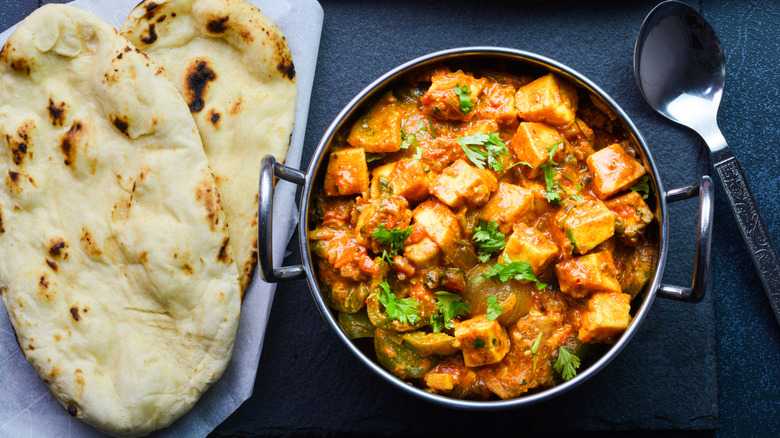 An Indian paneer curry served with naan