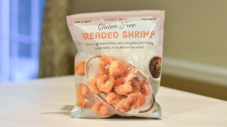 A bag of gluten-free breaded shrimp on a white counter