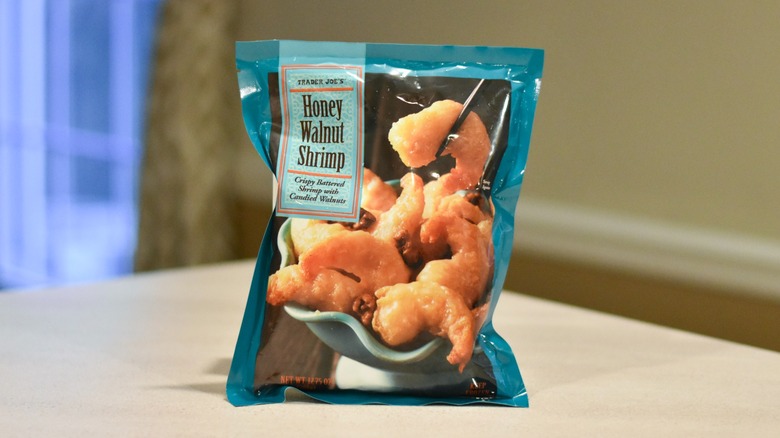 A bag of honey walnut shrimp on a white counter