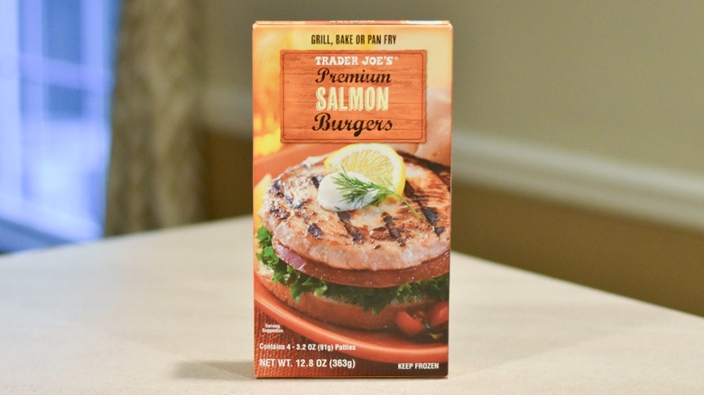 A box of Trader Joe's premium salmon burgers on a white counter