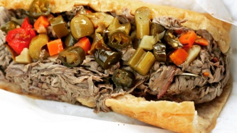 A closeup shows an Italian beef sandwich.