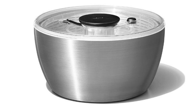 oxo salad spinner with stainless steel bowl on white backdrop