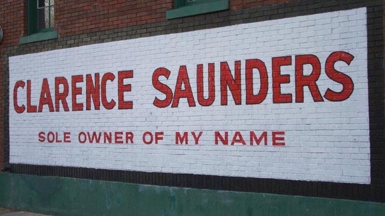 Red and white mural that reads: "Clarence Saunders Sole Owner of My Name"