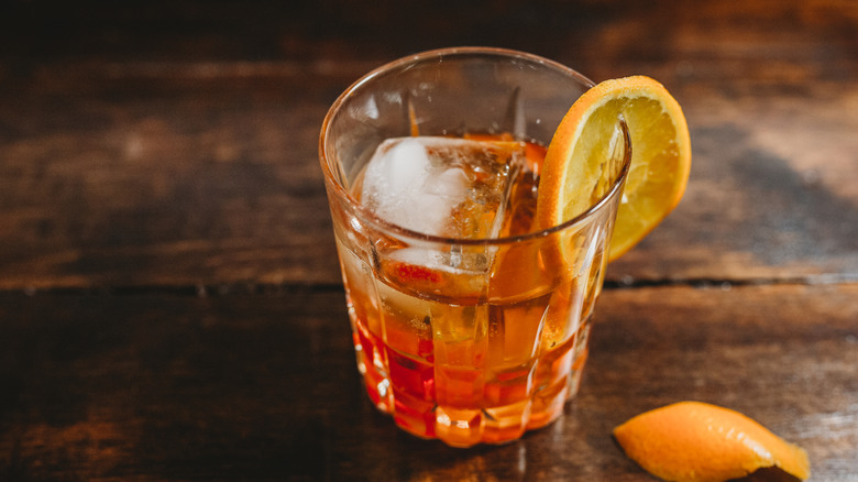 Old fashioned cocktail sitting on wood