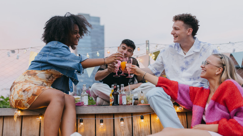 friends having drinks on a rooftop