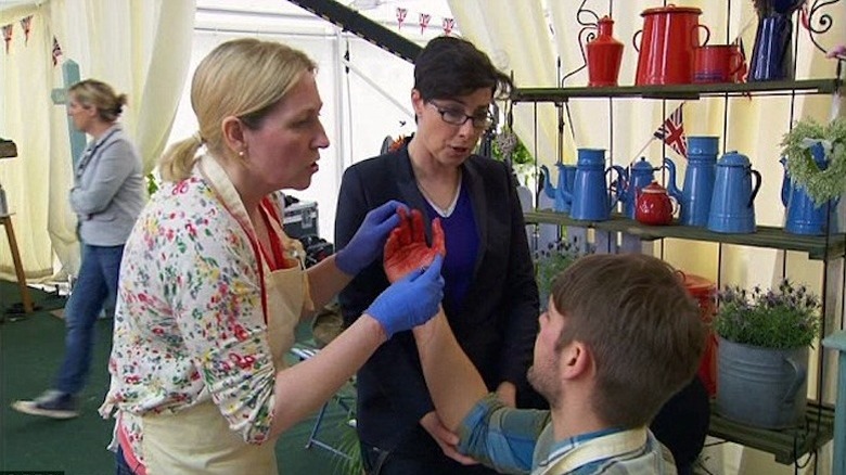 Danny Bryden, a doctor, and host Sue Perkins (right) take charge of the situation